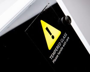Tempered glass warning label